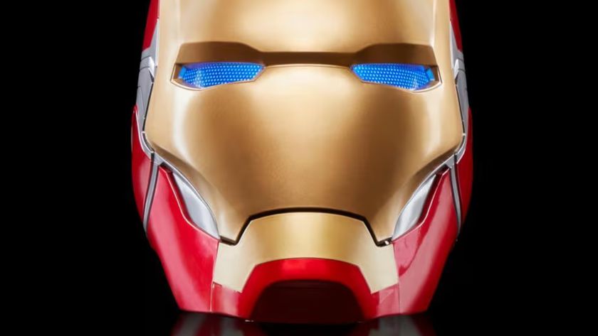 Iron Man Marvel Legends Helmet with glowing blue eyes against a dark background