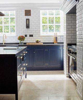 Kitchen with subway tiles and blue cabinetry