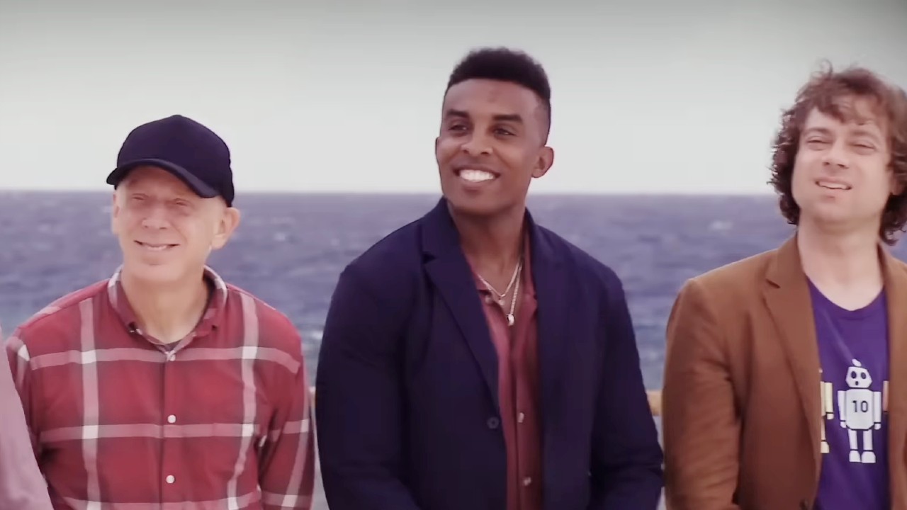 Kyle Fraser, Mike White, and Christian Hubicki standing next to each other in Survivor 50.