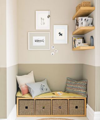 Cosy reading nook with shelving unit turned bench seat topped with cushions