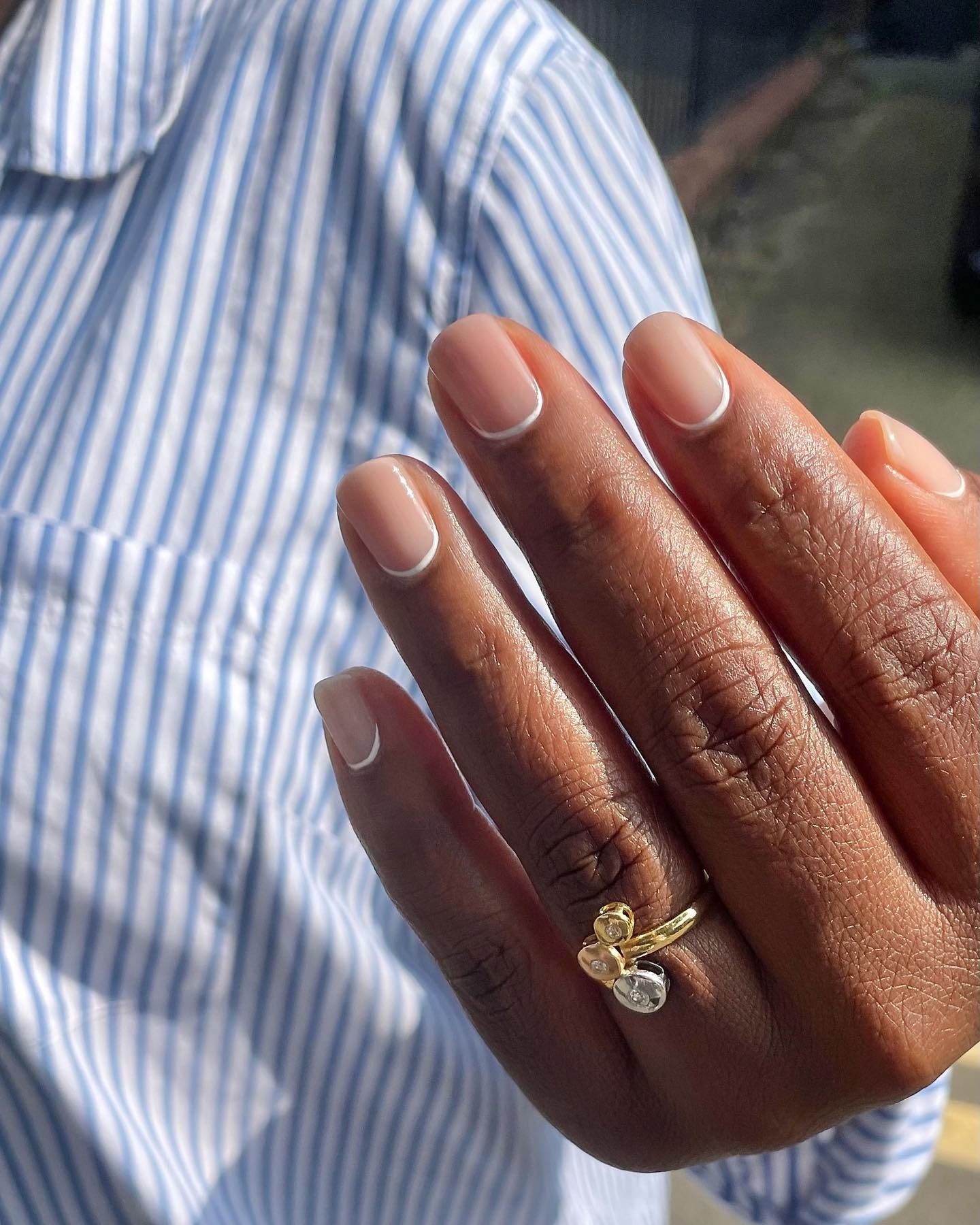 A classic white reverse French manicure