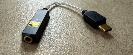 iFi GO Link 2 shot on a grey surface