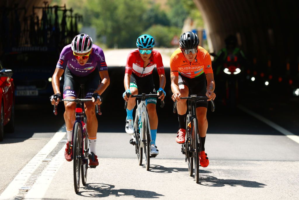 VILLADIEGO SPAIN AUGUST 03 LR Jess Ezquerra Muela of Spain and Team Burgos BH Diego Pablo Sevilla of Spain and EoloKometa Cycling Team Red Mountain Jersey and Xavier Mikel Azparren Irurzun of Spain and Team Euskaltel Euskadi compete in the breakaway during the 44th Vuelta a Burgos 2022a Stage 2 a 158km stage from Vivar del Cid to Villadiego on August 03 2022 in Villadiego Spain Photo by Gonzalo Arroyo MorenoGetty Images