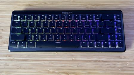 Roccat Vulcan II Mini Air gaming keyboard on a wooden desk 