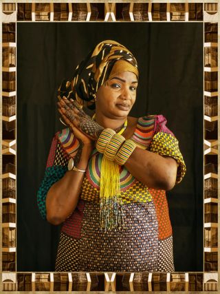 A portrait of a woman from Africa who is part of a group of women who have started a catering company in one of Paris' poorest areas