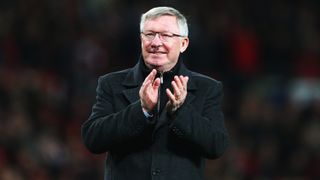 Football manager Alex Ferguson looking happy.
