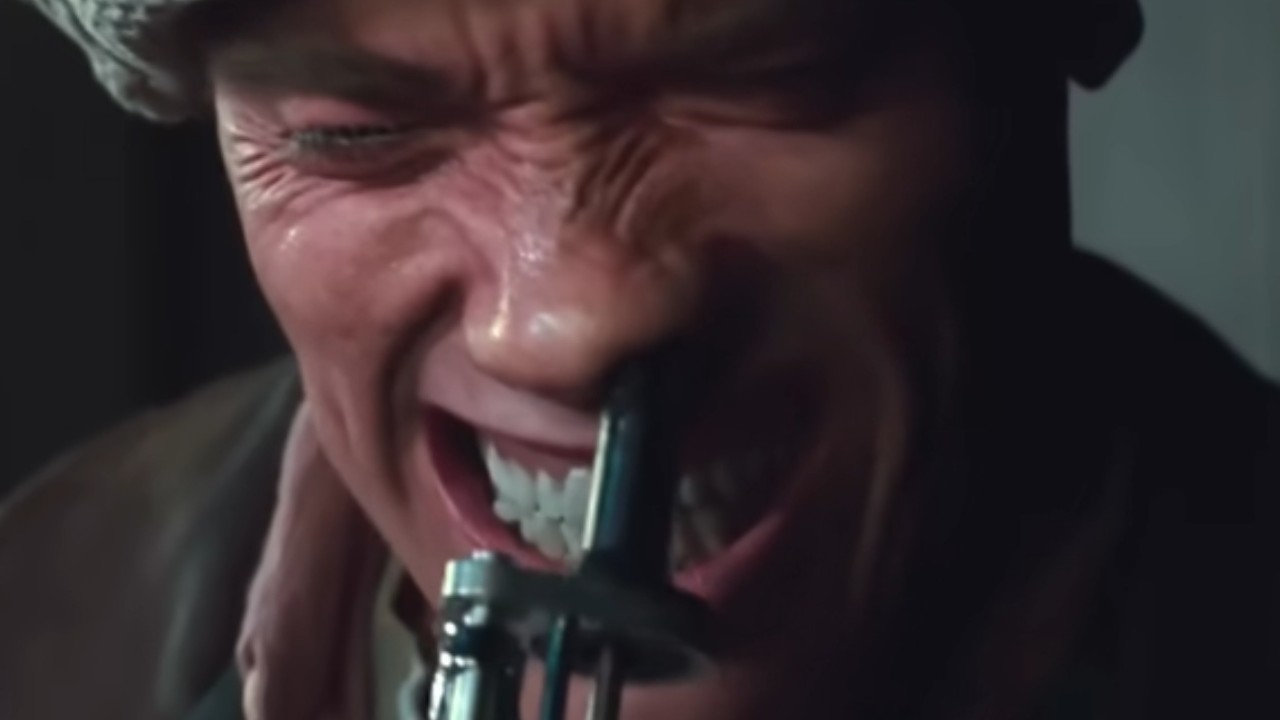 Arnold Schwarzenegger pulling something out of his nose in Total Recall