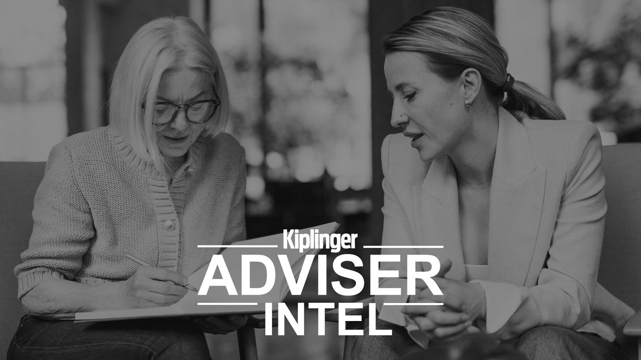 Black and white image of two women, possibly and adviser and her client looking at paperwork. The logo "Kiplinger Adviser Intel" is overlaid on the image