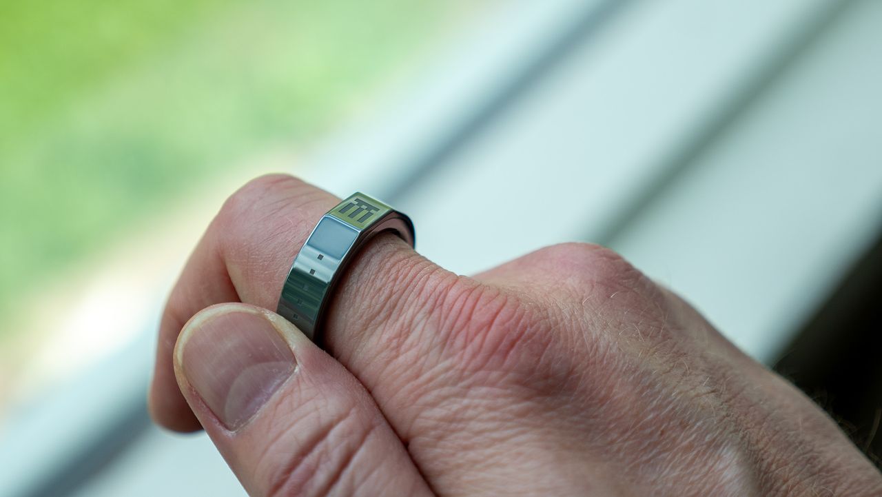 Tapping the touch pad of the Even Realities R1 smart ring with my thumb