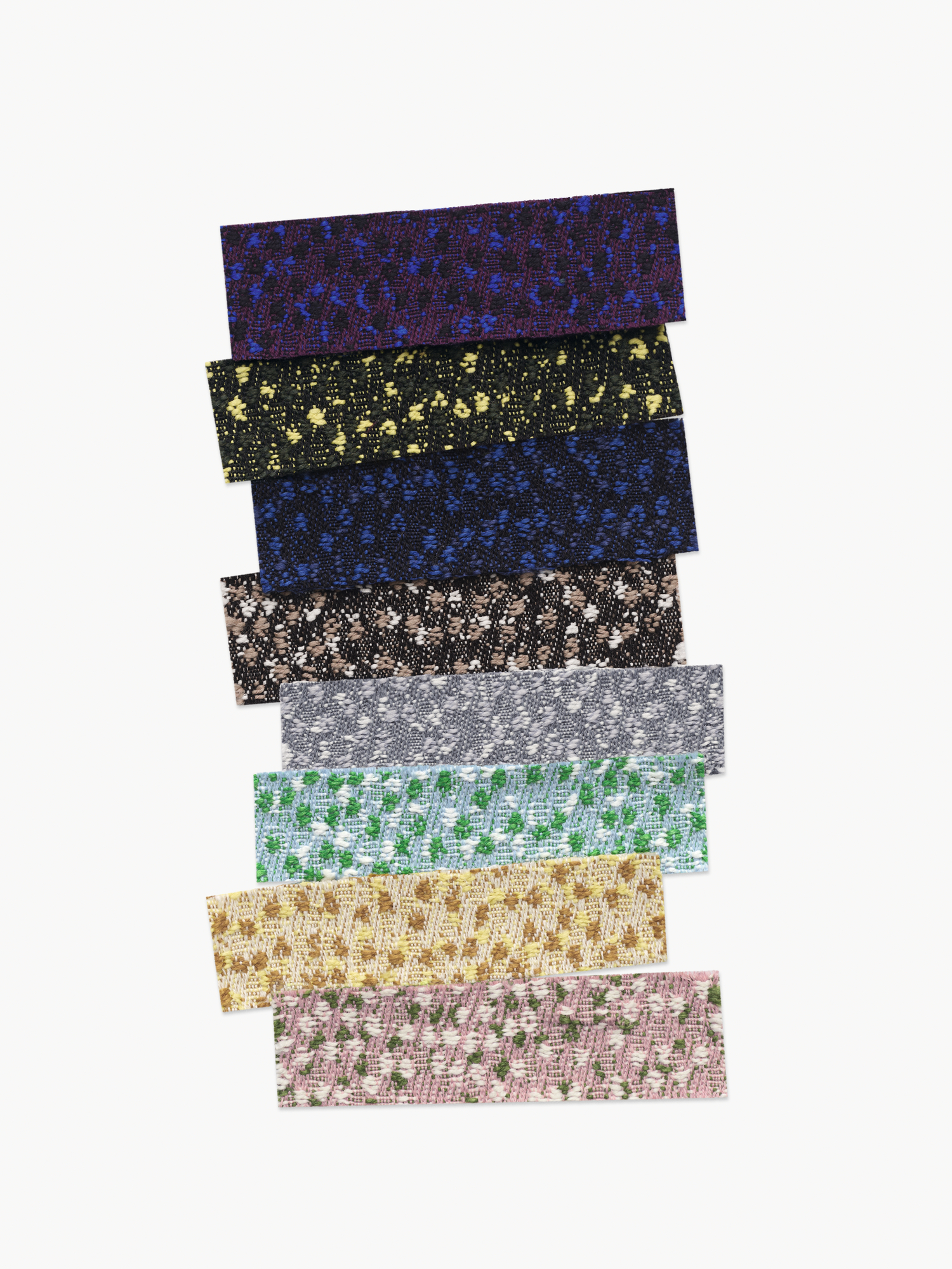 Strips of Ria2 dotted fabric by Raf Simons and Kvadrat in colours including yellow, pink, green, and aubergine