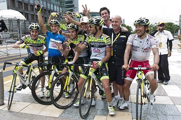 Three's a crowd: Stage winner, Andrea Guardini (blue), with his Farnese Vini/Neri Sottoli teammates and support staff after collecting his third stage win in Putrajaya.