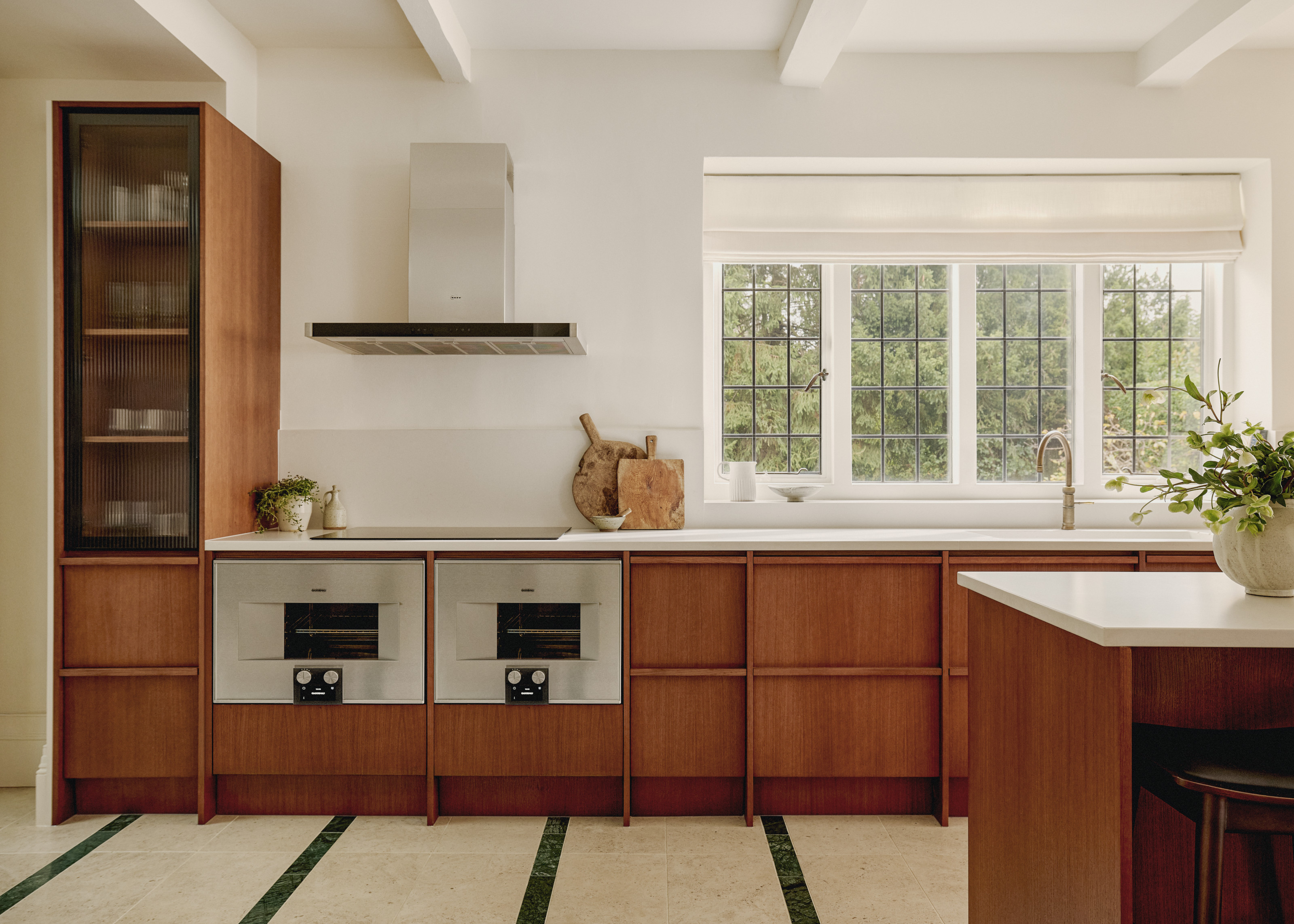 Oak kitchen with bespoke cabinetry and double oven