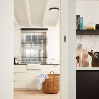 kitchen room with white walls and wooden basket