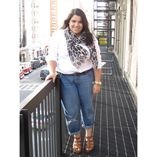 Ashley Falcon wearing a white button down and jeans
