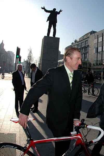 The imposing statue of the great trade unionist James 'Big Jim' Larkin seems to be rousing applause for the presentation of the An Post - Sean Kelly Team in O'Connell Street, Dublin.