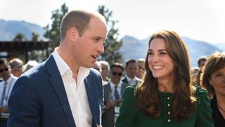 Prince William and Catherine, Princess of Wales smile at each other as they sample food cooked by Vikram Vij at Mission Hill Winery on September 27, 2016 in Kelowna, Canada