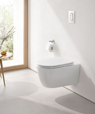 A white modern bathroom with wall hung toilet