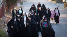 Veiled women walk in Tehran, Iran, on Dec. 26, 2024.