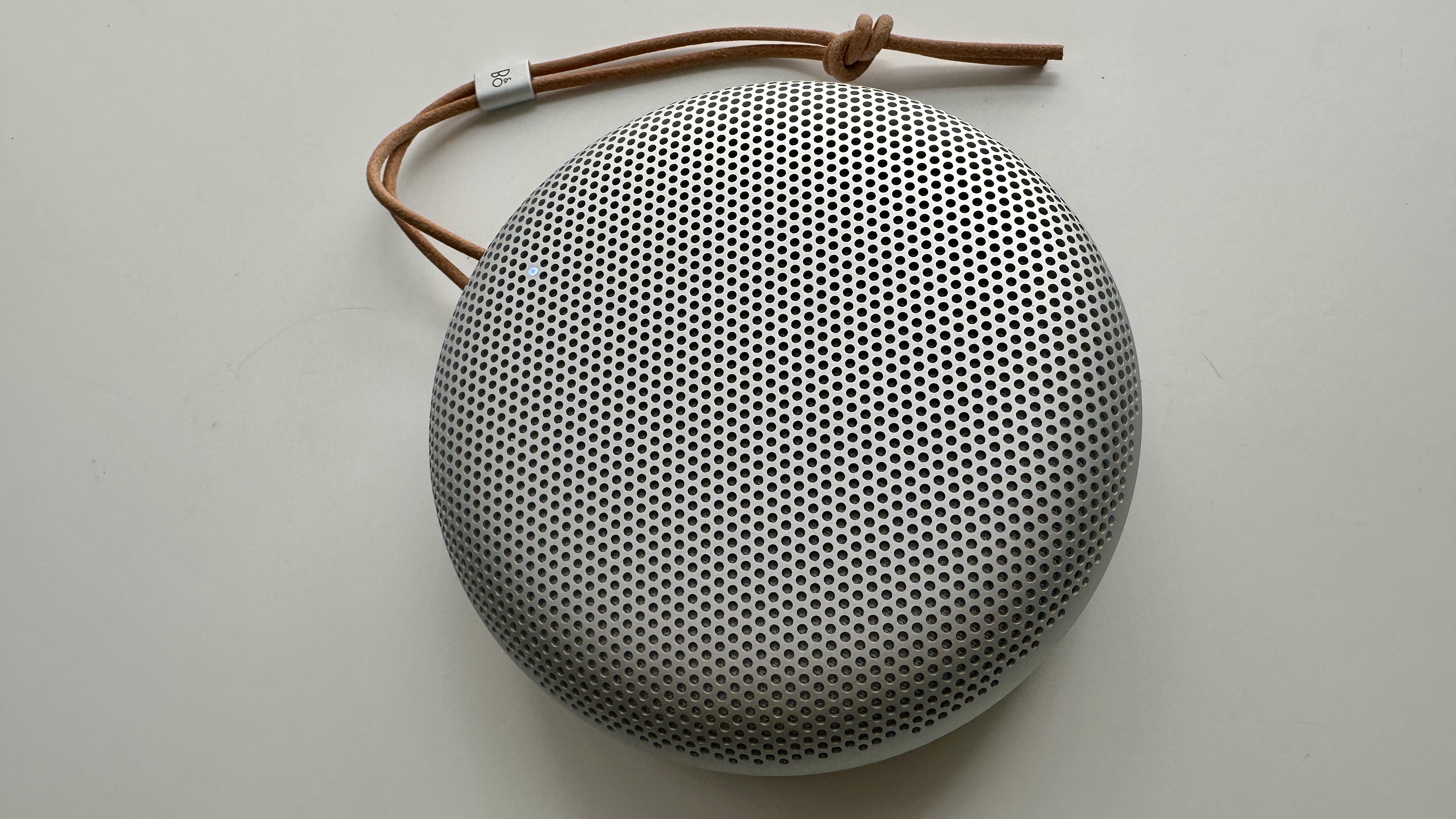 Bang & Olufsen Beosound A1 3rd Generation in silver, on gray table
