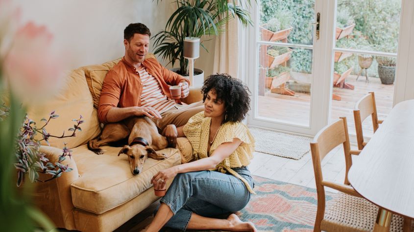 Couple relaxing together in a living room