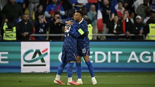 Rayan Cherki celebrates with France's forward #10 Kylian Mbappe