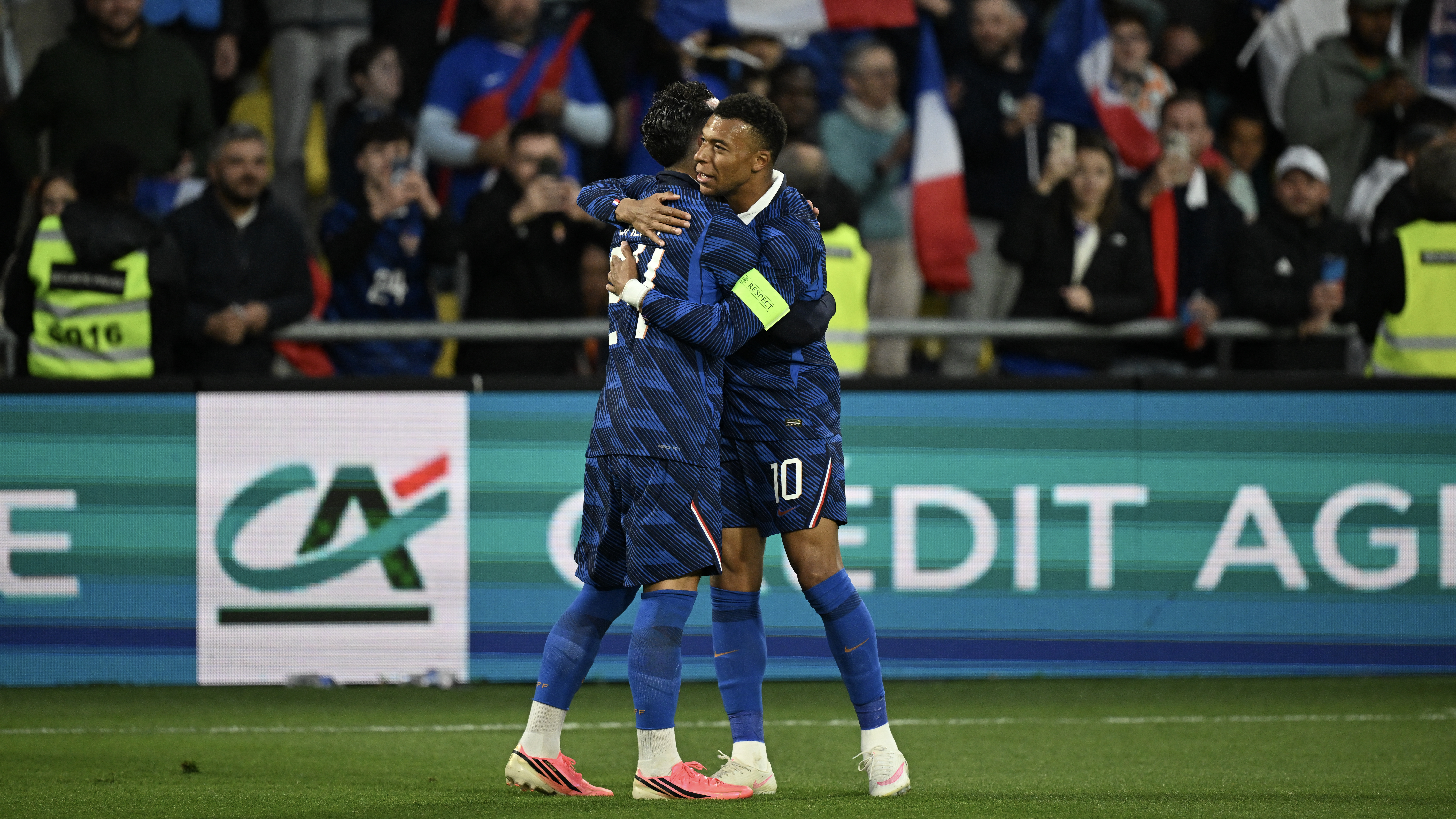 Rayan Cherki celebrates with France's forward #10 Kylian Mbappe