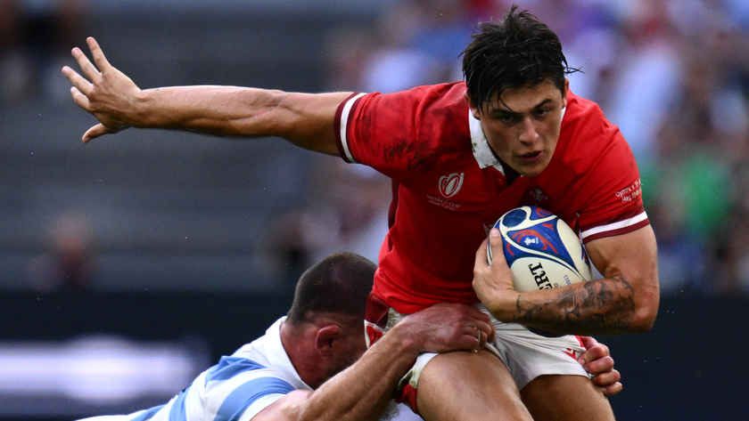 Wales&#039; wing Louis Rees-Zammit (R) is tackled by Argentina&#039;s flanker Marcos Kremer during the France 2023 Rugby World Cup quarter-final match between Wales and Argentina at the Stade Velodrome in Marseille, south-eastern France, on October 14, 2023. 