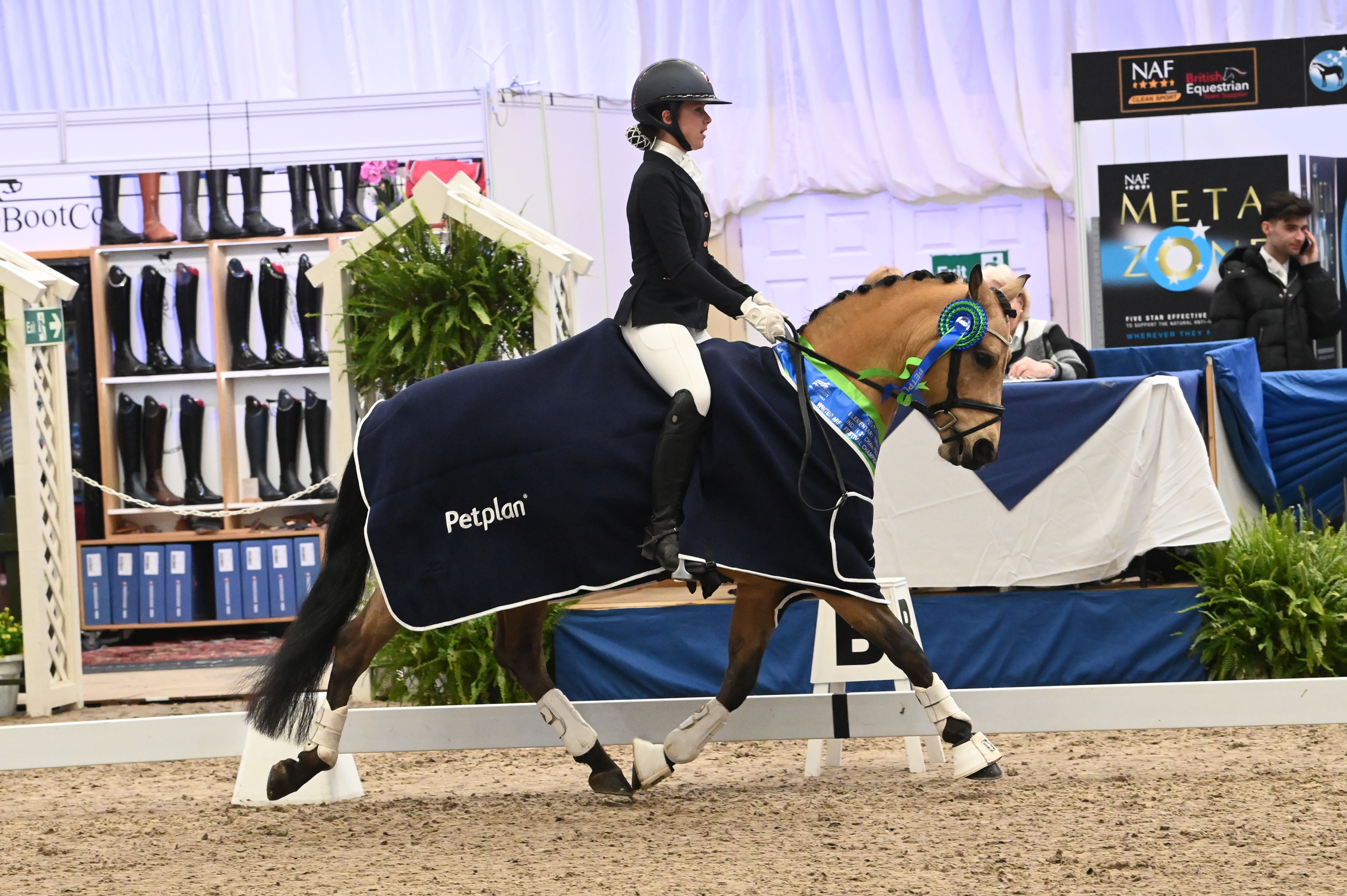 Lydia Holmes and Caramelle win the under-21 elementary bronze at the Petplan Winter Area Festival Championships.