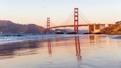 The Golden Gate Bridge and Baker Beach in San Francisco at sunset