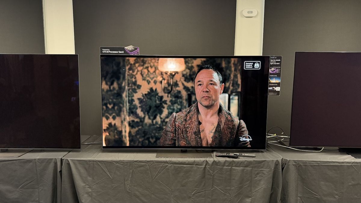 The 65-inch LG G5 OLED TV standing on a grey table. On the screen is an image from boxing TV show &#039;A Thousand Blows&#039;