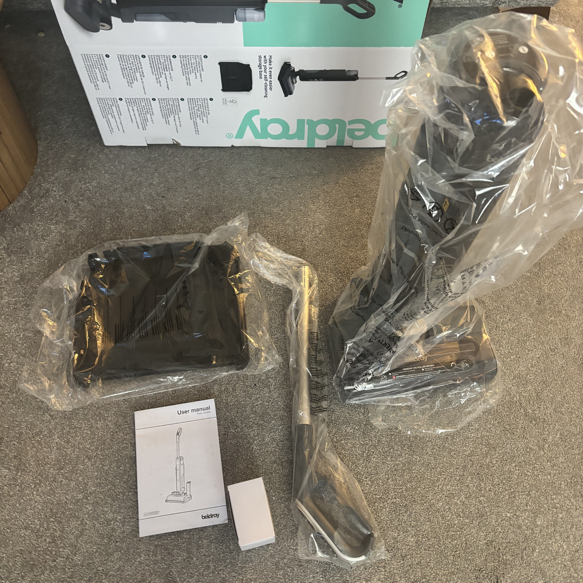 flatlay of All-in-One Multi-Surface Floor Cleaner parts and accessories 