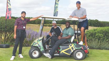 Members of Black British Golfers pose for a photo on a golf cart