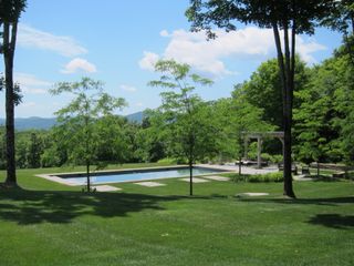 pool landscape ideas incorporating a dining area