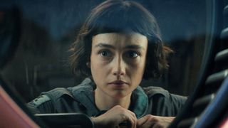 Wendy looking at something from behind a pane of glass in Alien: Earth