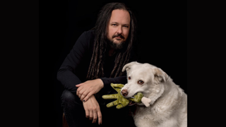 A picture of Jonathan Davis and a dog