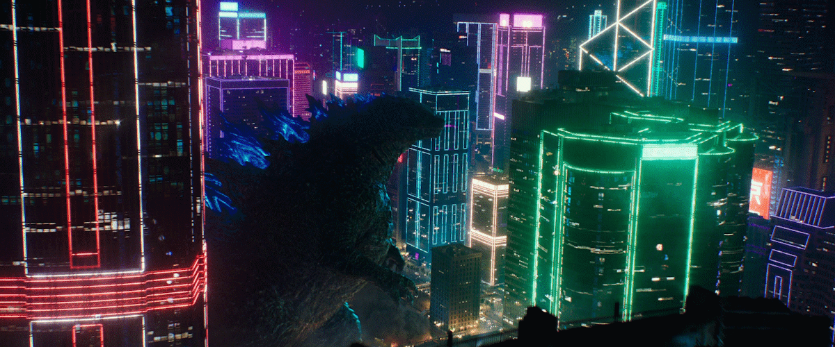 Godzilla vs. Kong Godzilla roars in a very colorful city