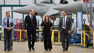 Prince William, Prince of Wales speaks with BA Systems apprentice Charlotte Wilson and Typhoon delivery director Martin Topping
