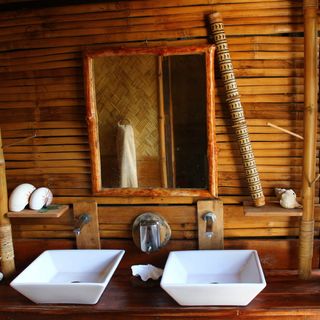 island bathroom with rustic bamboo mirror