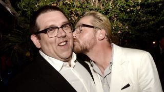 Simon Pegg kissing Nick Frost on the cheek in 2013