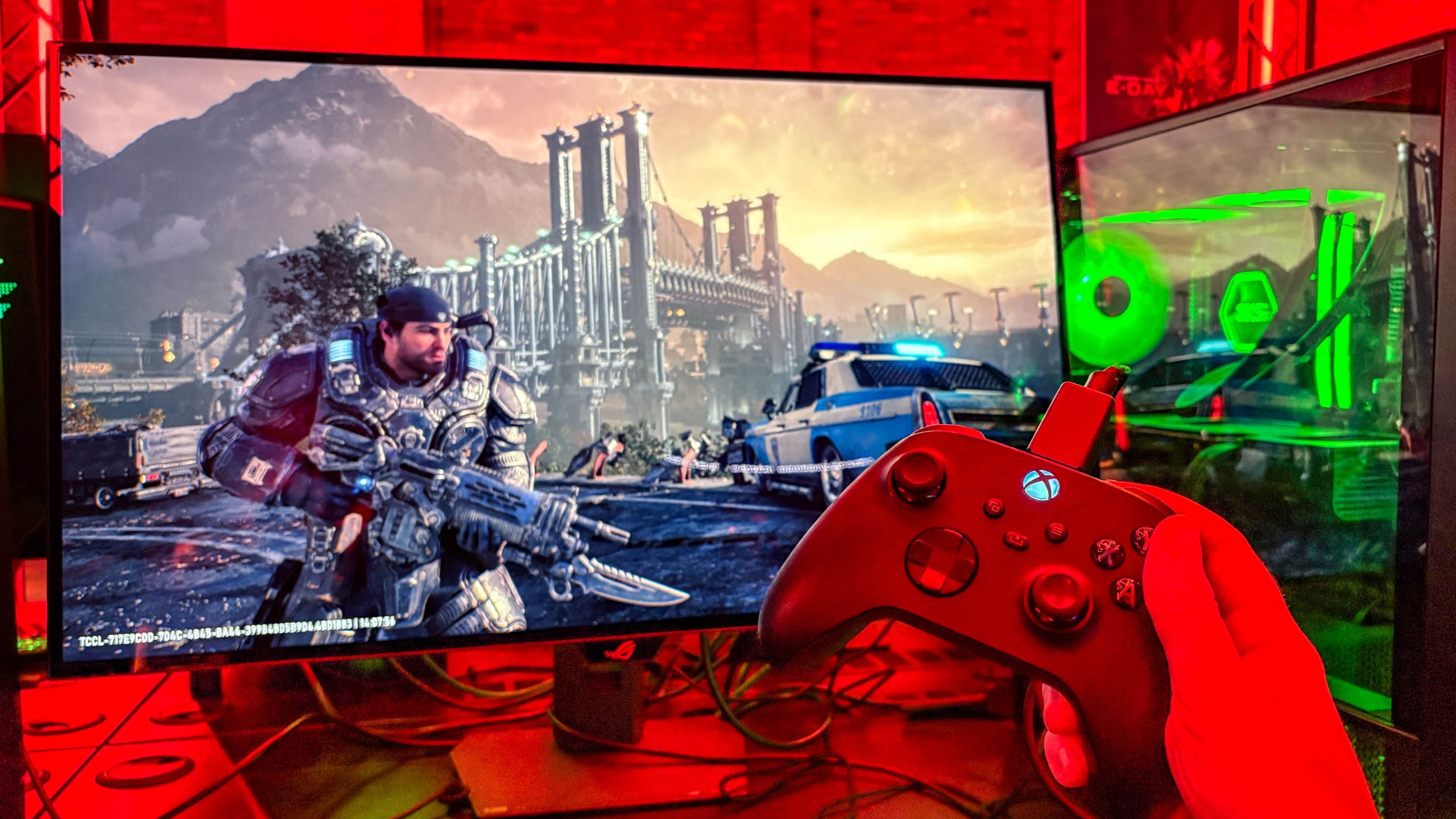 Gears of War: E-Day on monitor with Xbox controller in hand
