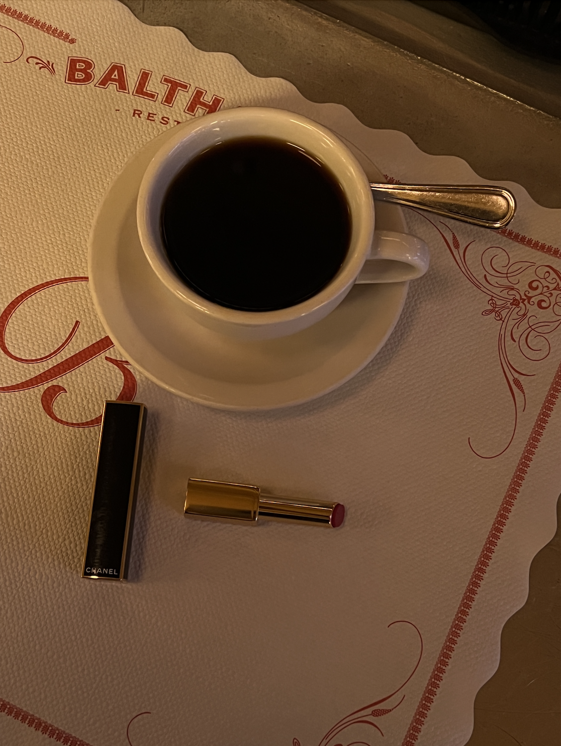 coffee cup with lipstick on table