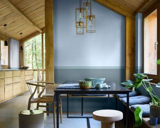 blue kitchen dining area with wooden beams