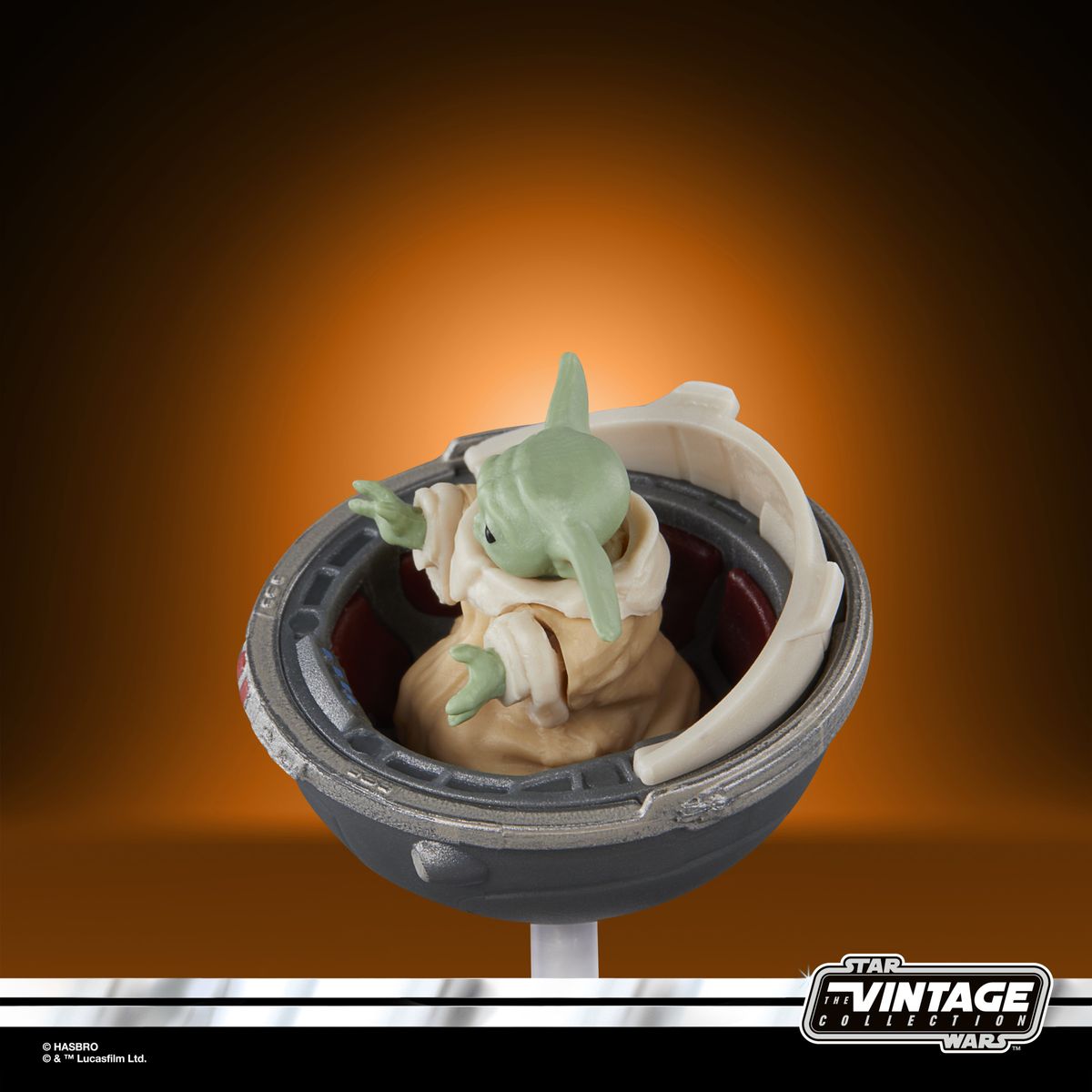 The Vintage Collection Grogu figure on an orange and black background