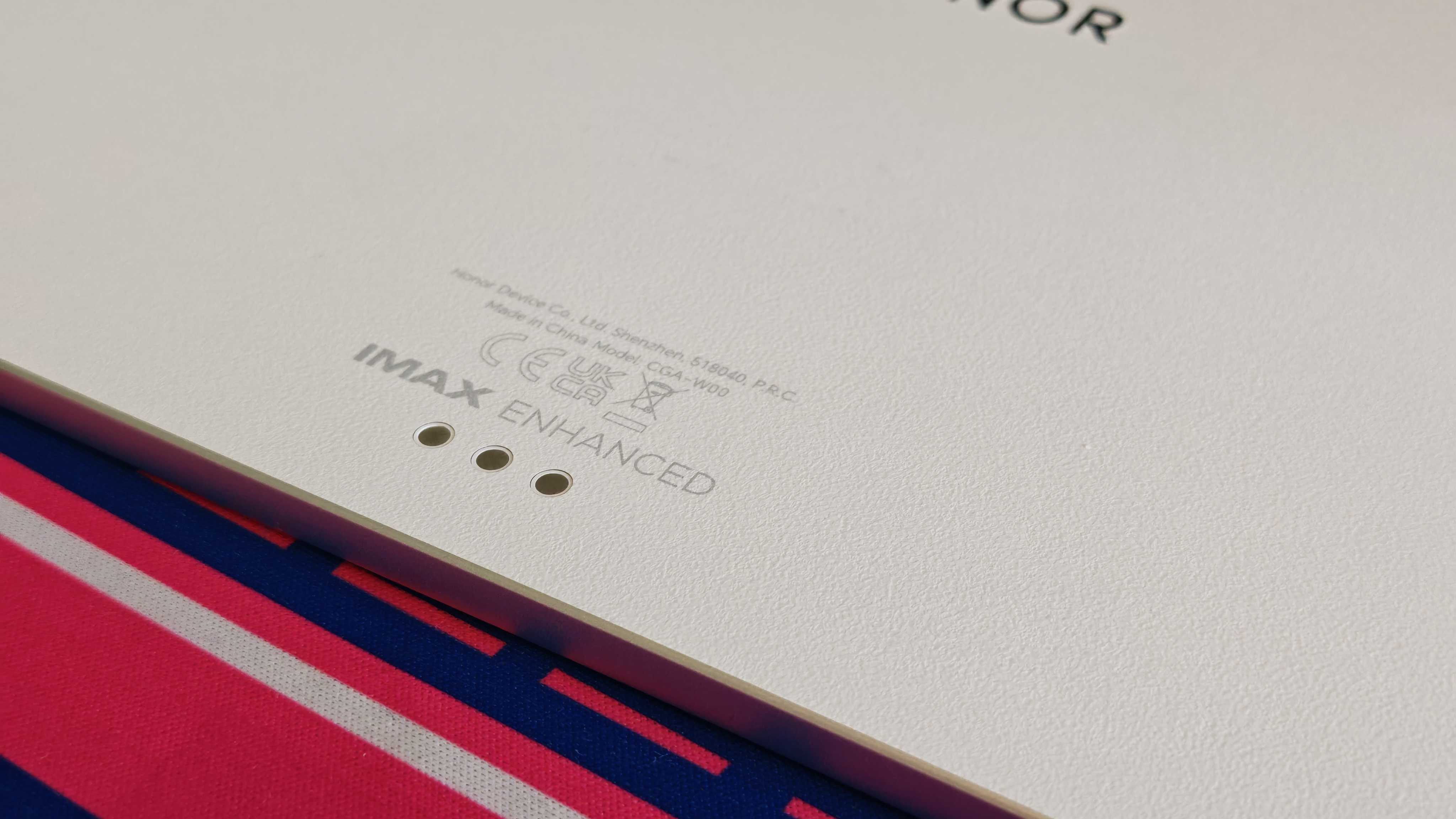 The Honor MagicPad 3 placed on a colorful desk mat.