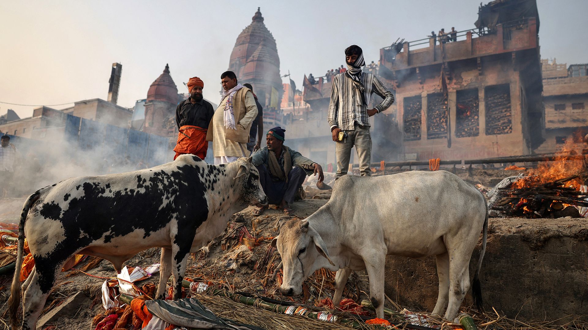 
                                Relatives gather for a funeral ceremony at the Manikarnika Ghat cremation grounds in Varanasi, India
                            
