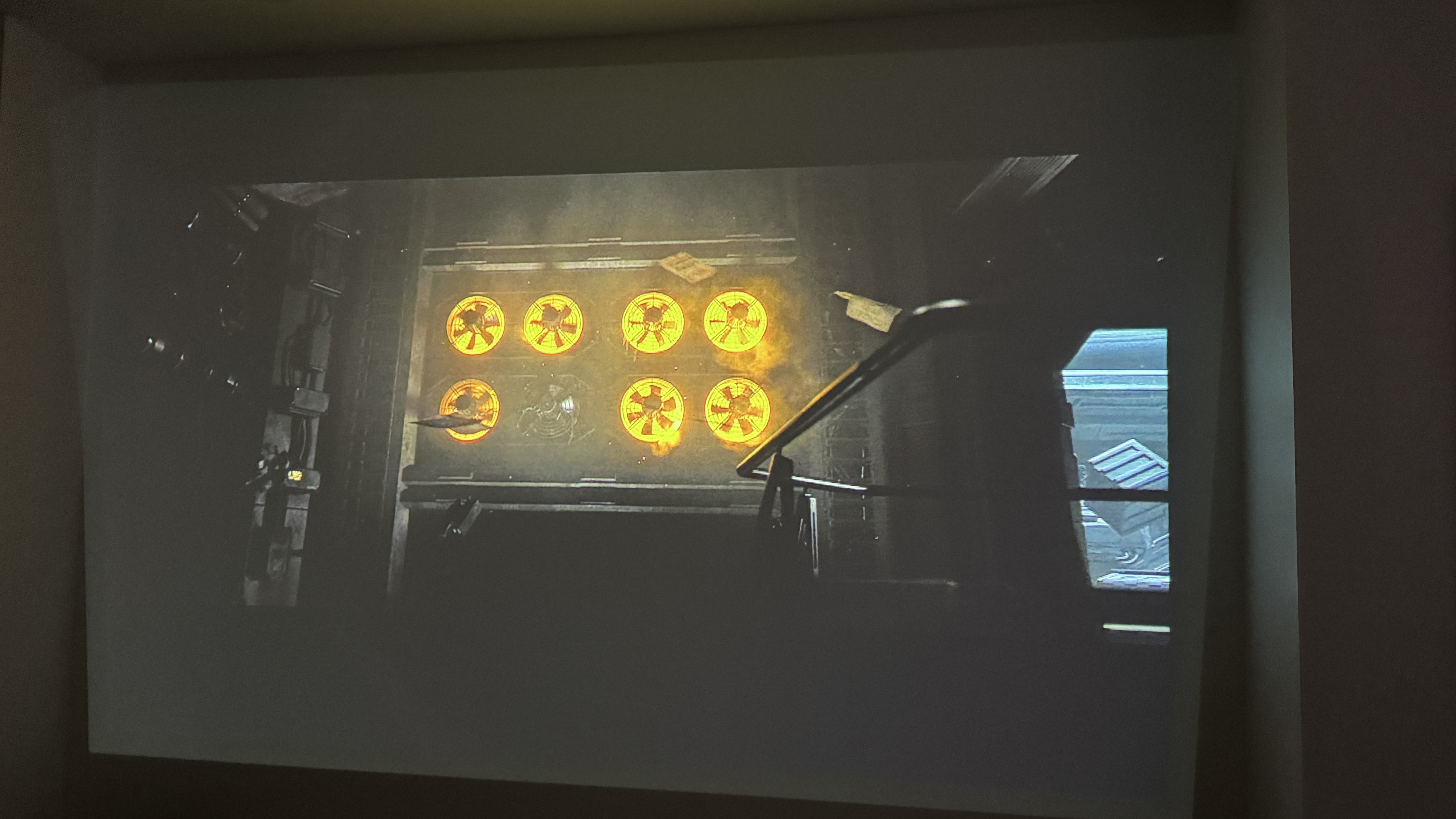 Dark scene from Alien: Romulus projected onto a wall by the XGIMI MoGo 3 Pro projector