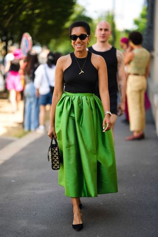 Tamu McPherson wears green skirt at Prada Menswear SS23