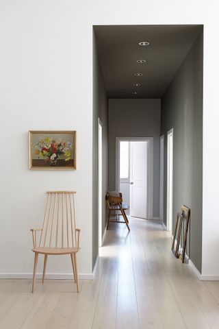 grey and white hallway with pale wooden floor