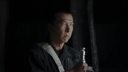 Donnie Yen holding a staff in Rogue One: A Star Wars Story