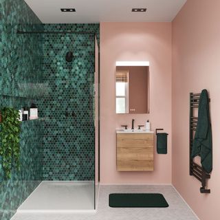 pink shower room with green wall tiles
